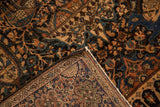 Corner of an antique Farahan Sarouk rug showing the hand-knotted foundation and dense wool pile.