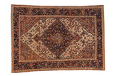 Vintage distressed Malayer rug with an oversized navy medallion surrounded by ivory and copper floral arabesques.