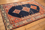 Detail of the Serbend-inspired germinating plant border and terracotta corner spandrel on the vintage Malayer rug.