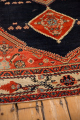 Detail of a Malayer rug's corner showing the Herati spandrel and Serbend-inspired floral border.