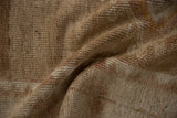 The hand-knotted wool foundation on the reverse of the distressed Kars carpet.