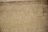 Distressed vintage Kars carpet pile showing heavy abrashes and subtle trellis design.