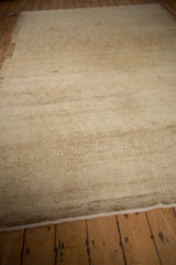 Distressed Kars carpet showcasing faded trellis design, soft abrashes, and neutral tones.