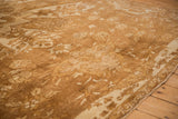 Hand-knotted short pile of a distressed Kars carpet with time-softened floral motifs in brown and sand.