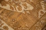 Short, textured pile of a vintage distressed Kars carpet with floral motifs in coffee brown and ivory.