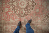Distressed vintage Oushak carpet showing a soft pile with dusty rose and pale coffee brown tones.