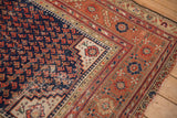 Corner of antique Malayer rug, navy boteh field, brick red, ivory borders, with mostly even wear.
