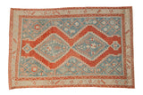 Vintage distressed Karabagh rug with a stepped double medallion in cherry red, dusty sky blue, and ivory.