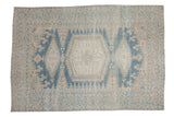 Vintage distressed Persian Veece carpet with a triple medallion in soft dusty blue and ivory.