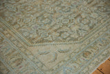 Distressed Hamadan carpet corner, highlighting textural Herati field and faded palmette border.