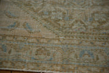 Distressed Hamadan carpet texture showing worn pile, subtle beige, blue, and green hues.
