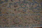 Hand-knotted pile showing mostly even wear on a vintage distressed Tabriz carpet.