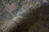 Detailed texture of a distressed Tabriz carpet with mostly even wear to the knot heads.
