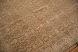 Visible knot heads and color abrashes on the distressed surface of a Persian Bijar rug.