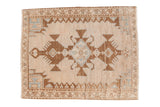 Vintage distressed Hamadan rug with a triple medallion in chocolate brown and powder blue on an abrashed field.