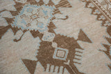 Evenly worn pile of a vintage Hamadan rug with serrated brown and powder blue motifs.