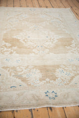 Heavy abrashes and worn texture seen from an angle on a vintage Persian Hamadan carpet.