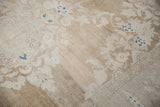Low pile texture showing heavy color abrashes on a distressed vintage Persian carpet.