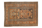 Antique Tabriz rug with a central Tree of Life design on a rust field, framed by intricate floral borders.