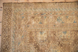 Mostly even wear across the knot heads and intact side cord of a vintage Afghan rug.