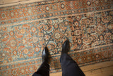 A personal viewpoint of the distressed Persian Malayer runner's time-softened texture and pattern.