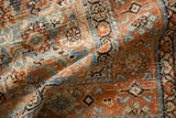 Soft, distressed pile of a hand-knotted Malayer rug with rust, sky blue, and platinum Herati details.