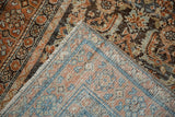 The hand-knotted foundation and machine-bound edge of a distressed Persian Malayer runner.