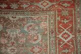 Pale red crab-style border next to the distressed, dusty blue Herati-patterned field.