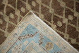 Antique Hamadan rug's hand-knotted blue, ivory foundation and abrash-toned brown pile.