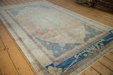 Vintage distressed Sivas carpet, pale rose field showing mostly even wear and sapphire border.