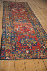 Vintage Karaja runner's brick red field with sapphire blue hook and latch geometric motifs.