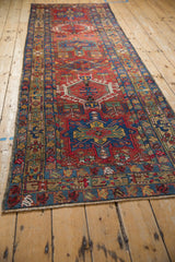 Sapphire blue minor border with primitive blossom motif on Vintage Karaja runner.