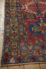 Vintage Karaja runner corner, primitive blossom and vine borders in blue, gold, red, short fringe.