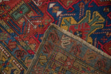 Vintage Karaja rug runner's hand-knotted construction, showing colorful pile and intricate back weave.