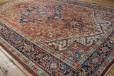 Dramatic angle of a vintage Heriz carpet's serrated medallion and intricate turtle samovar border.