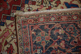 Secured end and hand-knotted foundation visible on the back of a vintage Heriz rug.
