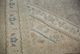 Detail of a Bibikabad corner spandrel, showing distressed low pile and powder blue floral accents.