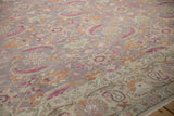 Distressed low-pile texture showing the weave of the floral Herati design.