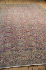 Low angle view across the distressed Herati field of a vintage Turkish Kayseri carpet.