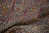 Softly draped vintage Kayseri carpet showing the low pile with paisley boteh and floral designs.