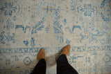 Low, worn pile of a distressed Ahar carpet showing the blue turtle samovar main border.