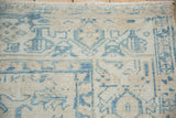 Ahar carpet corner with sky blue turtle samovar border design and distressed ivory pile.