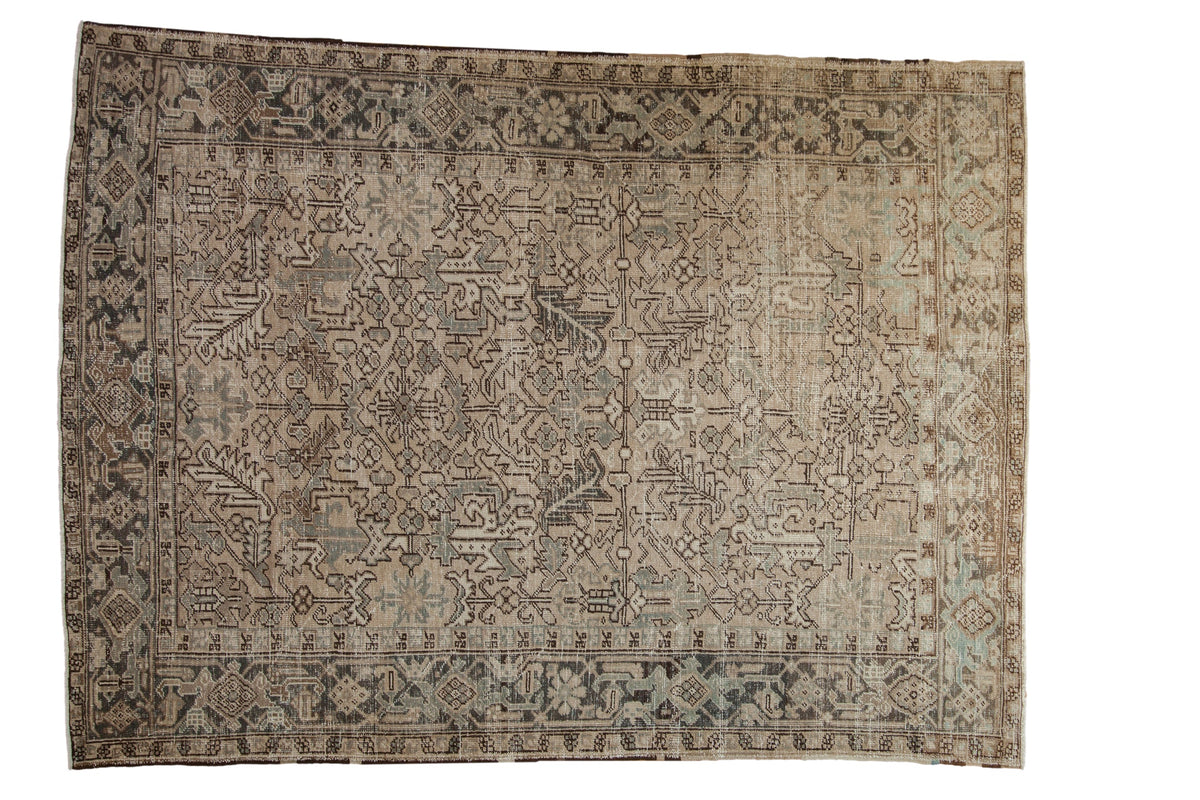 Vintage distressed Heriz carpet with a geometric design in soft beige, charcoal, and slate blue.