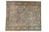 Vintage distressed Heriz carpet with a curvilinear allover design in earthy tones of beige, dusty blue, and chocolate brown.