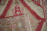 A corner folded back shows the hand-knotted foundation and restored side cord selvage.