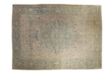 Vintage distressed Ahar carpet with a central starburst medallion and floral field in soft beige, ivory, and sky blue.