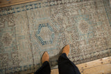 Distressed Karaja runner texture with heavy abrashes, geometric patterns, and jade green.