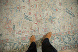 Close view of a Heriz carpet's field and border, detailing the hand-knotted texture and mostly even wear.