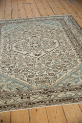 Distressed Hamadan rug detail with geometric Herati pattern, softened ivory, brown, and blue pile.