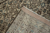 Vintage distressed Hamadan rug pile and its hand-knotted foundation.